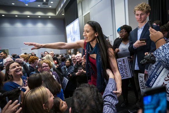 epaselect epa07147375 Democratic House candidate from Kansas Sharice Davids celebrates after winning her race at her election night watch party at the Embassy Suites Hotel in Olathe, Kansas, USA, 06 N ...