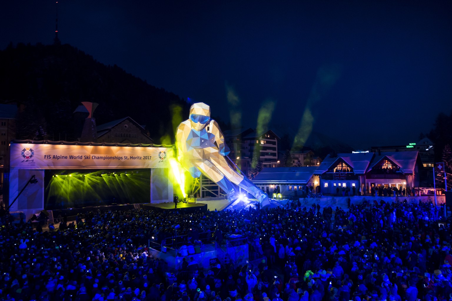 People attend the opening ceremony of the 2017 FIS Alpine Skiing World Championships in St. Moritz, Switzerland, Monday, Feb. 6, 2017. (Jean-Christophe Bott/Keystone via AP)