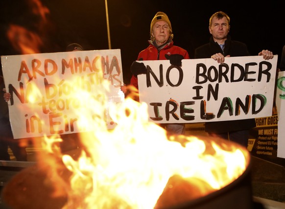 FILE -In this Friday, Jan. 31, 2020 file photo, protesters from the campaign group Border Communities Against Brexit take part in a demonstration in Carrickcarnon on the Irish border, Ireland. Britain ...