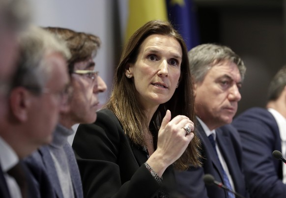 epa08290735 Belgian Prime Minister Sophie Wilmes (C) and Presidents of Regions hold a news conference after a national security council meeting on coronavirus, in Brussels, Belgium, 12 March 2020. The ...