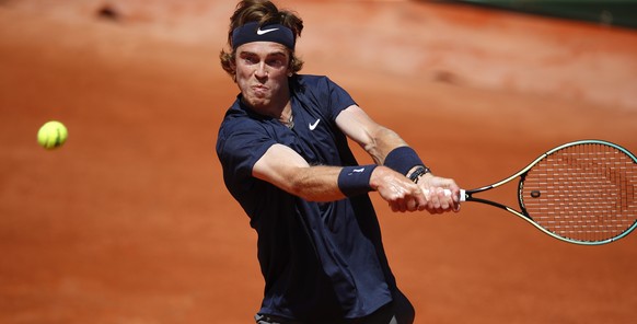 epa09240823 Andrey Rublev of Russia in action against Jan-Lennard Struff of Germany during their first round match at the French Open tennis tournament at Roland Garros in Paris, France, 01 June 2021. ...