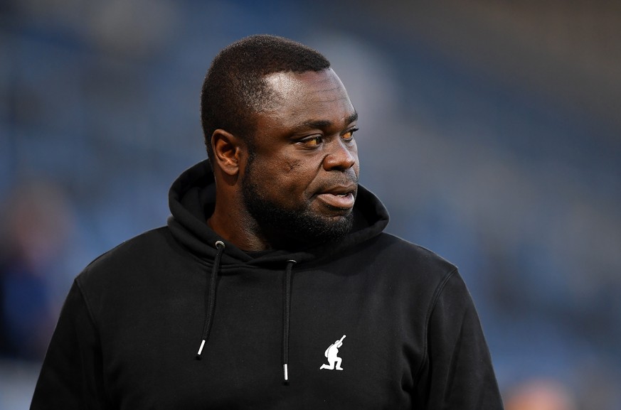 epa09148001 FC Schalke 04 team manager Gerald Asamoah looks on prior to the German Bundesliga soccer match between Arminia Bielefeld and FC Schalke 04 at Schueco Arena in Bielefeld, Germany, 20 April  ...