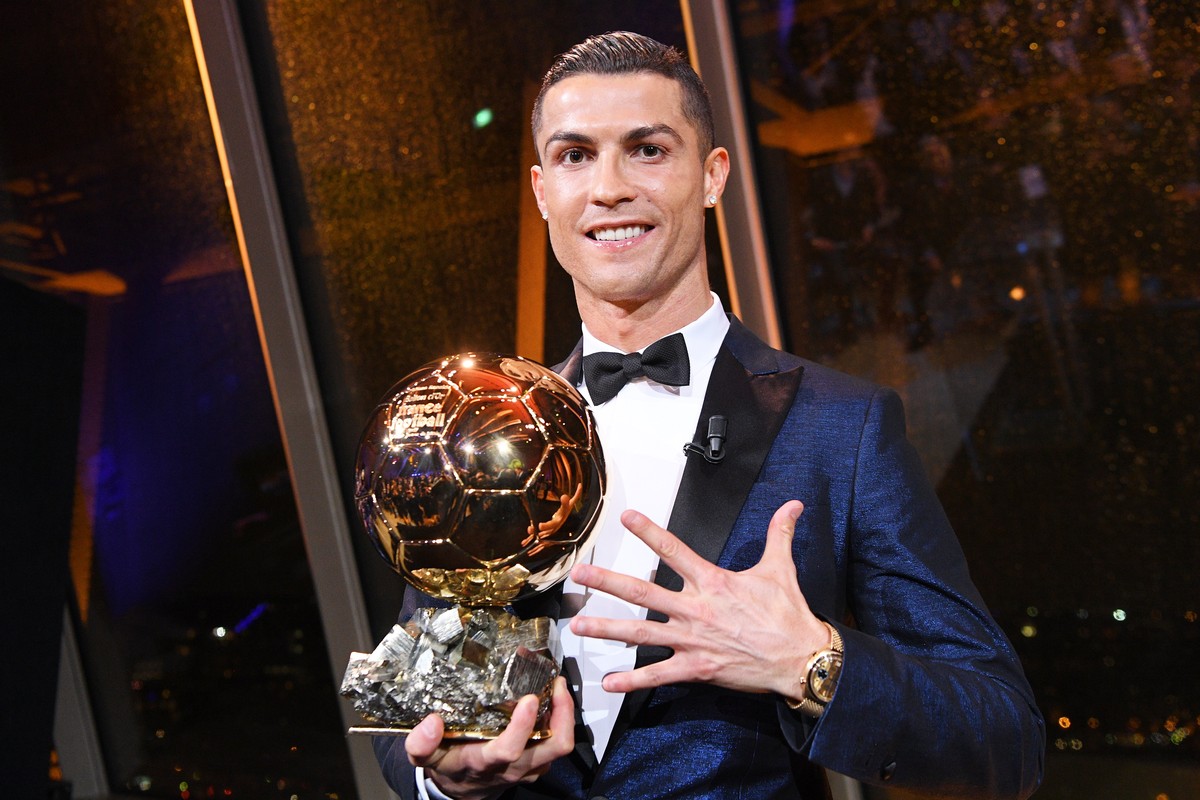 epa06375921 A handout photo made available by the l'Equipe Presse Office of Real Madrid's Portuguese striker Cristiano Ronaldo posing with his trophy after receiving the 62nd Ballon d'O ...