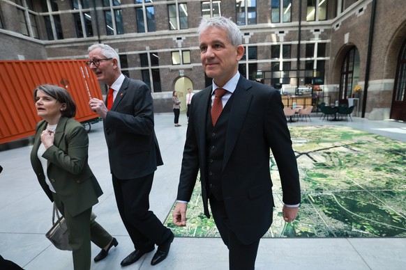 epa12876843 Swiss Federal Councillor for Justice and Police Beat Jans (R) looks on during a briefing with Port of Antwerp officials, featuring an aerial port overview, in Antwerp, Belgium, 09 April 20 ...