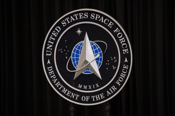 epa09896814 The US Space Force emblem is displayed during a visit by US Vice President Kamala Harris at the Vandenberg Space Force Base in Lompoc, California, USA, 18 April 2022. EPA/ETIENNE LAURENT