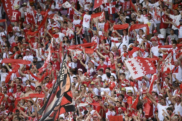 Fans of FC Sion cheer for their team during the Swiss Cup final soccer match between FC Basel 1893 and FC Sion at the stade de Geneve stadium, in Geneva, Switzerland, Thursday, May 25, 2017. (KEYSTONE ...