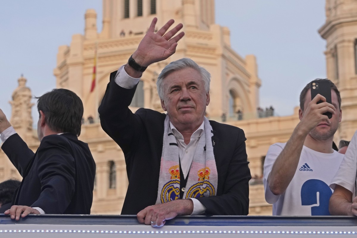 Real Madrid's head coach Carlo Ancelotti waves during celebrations after Real Madrid won the Spanish La Liga title by defeating Espanyol in Madrid, Spain, Saturday, April 30, 2022. (AP Photo/Paul ...