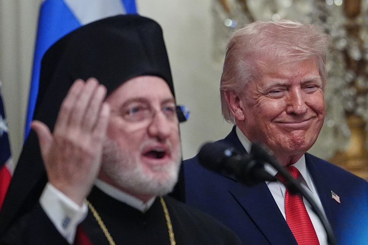 President Donald Trump listens as Elpidophoros of America speaks at a reception celebrating Greek Independence Day, in the East Room of the White House, Thursday, March 26, 2026, in Washington. (AP Ph ...
