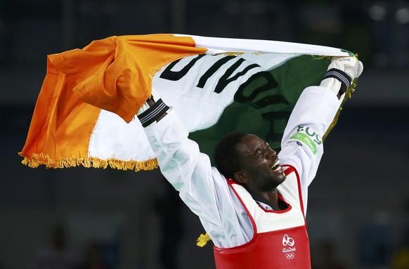 2016 Rio Olympics - Taekwondo - Men&#039;s -80kg Gold Medal Finals - Carioca Arena 3 - Rio de Janeiro, Brazil - 19/08/2016. Cheikh Sallah Cisse (CIV) of Ivory Coast celebrates after defeating Lutalo M ...