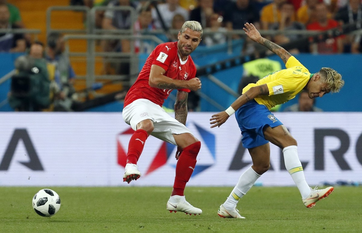 Switzerland's Valon Behrami, left, duels for the ball with Brazil's Neymar during the group E match between Brazil and Switzerland at the 2018 soccer World Cup in the Rostov Arena in Rostov- ...