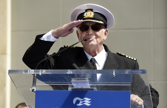 FILE - In this May 10, 2018 file photo, Gavin MacLeod, a cast member on the TV series "The Love Boat," salutes the crowd as he speaks at a Friends of Hollywood Walk of Fame honorary star pla ...