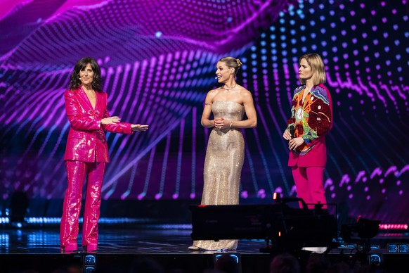 epa12107330 (L_R) The hosts Sandra Studer, Michelle Hunziker and Hazel Brugger during the dress rehearsal for the Grand Final of the 69th Eurovision Song Contest (ESC) in Basel, Switzerland, 16 May 20 ...