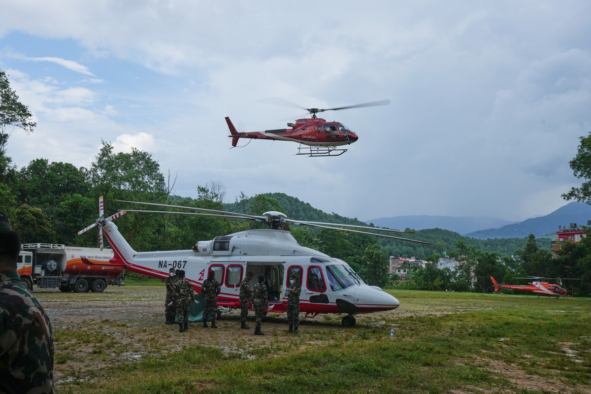 Helicopters ferry injured and stranded people from the area which are cut off due to flash flooding in Nuwakot district in Nepal, Friday, Aug. 28, 2026. (AP Photo/Rajesh Kumar Singh)
Nepal Flash Flood ...