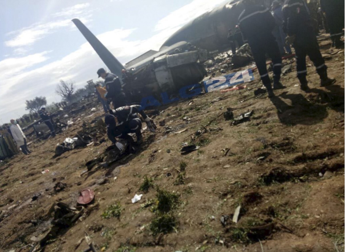 This image dated Wednesday, April 11, 2018, and posted by Algerian news agency ALG24, shows firefighters and soldiers at the scene of a fatal military plane crash near Boufarik military base near the  ...