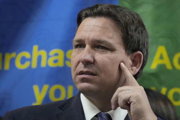 FILE - Florida Gov. Ron DeSantis listens to a question during a press conference Sept. 7, 2022, in Miami, Fla. The Republican governors of Florida and Texas have delivered migrants on planes and buses ...