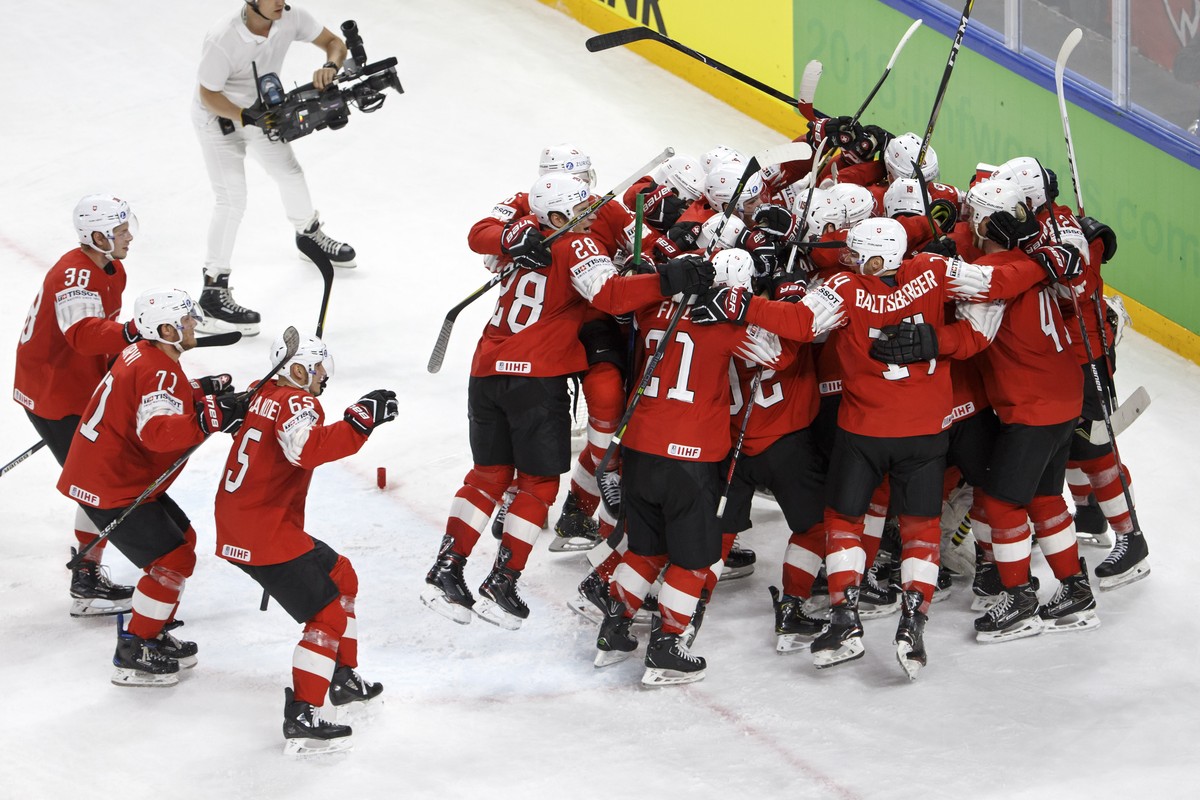 Switzerland's players celebrate their victory after beating Canada, during the IIHF 2018 World Championship semi final game between Canada and Switzerland, at the Royal Arena, in Copenhagen, Denm ...