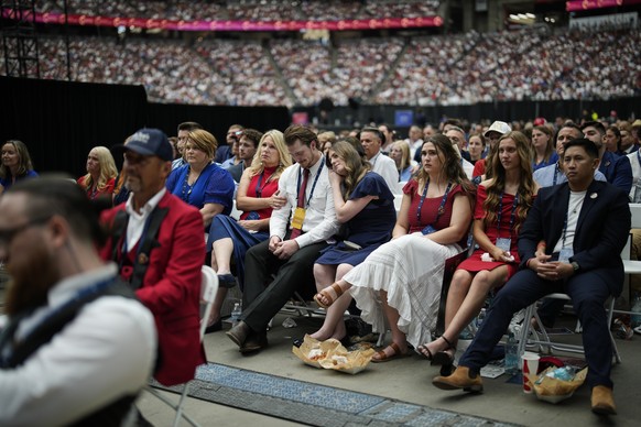 People listen as Erika Kirk speaks at a memorial for her late husband conservative activist Charlie Kirk, Sunday, Sept. 21, 2025, at State Farm Stadium in Glendale, Ariz. (AP Photo/John Locher)
Charli ...