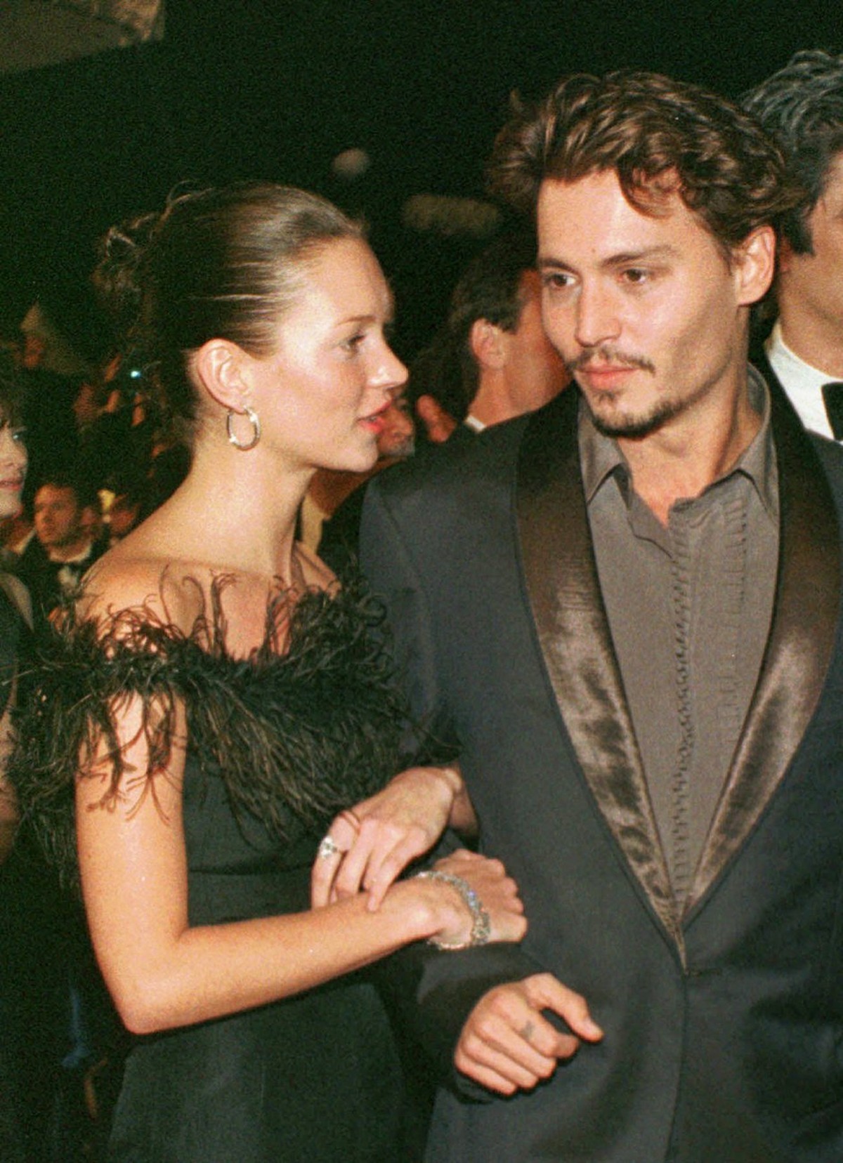 Johnny Depp arrives with supermodel Kate Moss at the Festival Palace in Cannes to attend the screening of Depp's latest movie May 15, 1998. Depp says in an interview Friday, Nov. 11, 2005, with a ...
