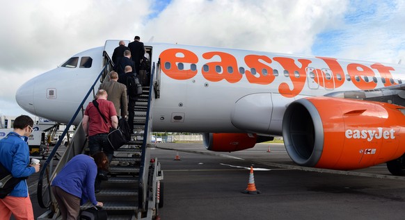 epa07477990 (FILE) - Passengers board an airplane of low cost carrier Easyjet in Belfast, Northern Ireland, Britain, 19 June 2013 (reissued 01 April 2019). Easyjet on 01 April 2019 said the demand for ...