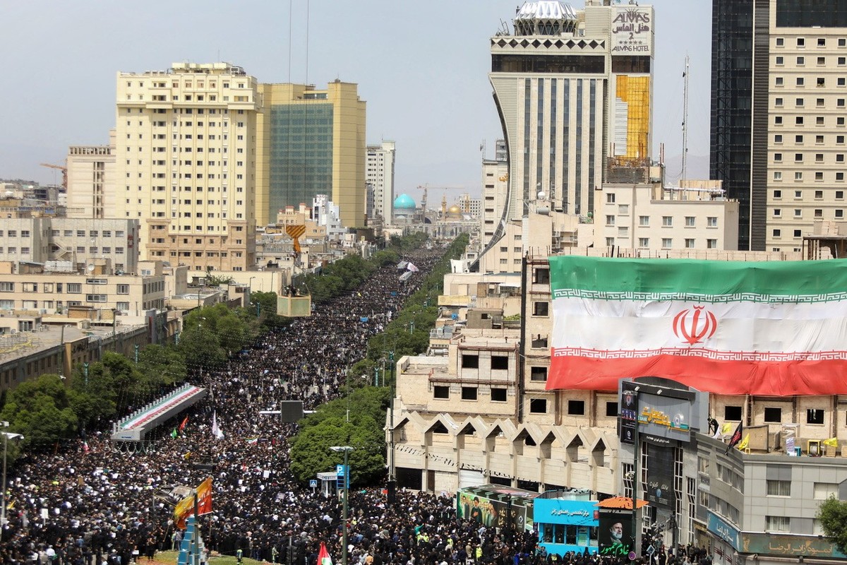 epa11363155 A handout photo made available by the Iranian presidency shows, Iranians take part in late president Ebrahim Raisi funeral ceremony in Mashhad, Iran, 23 May 2024. Iranian president Raisi a ...