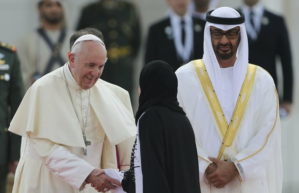 Pope Francis shakes hands with Amal Al Qubaisi, the President of the UAE Federal National Council, in the presence of the Abu Dhabi&#039;s Crown Prince Sheikh Mohammed bin Zayed Al Nahyan, right, and  ...