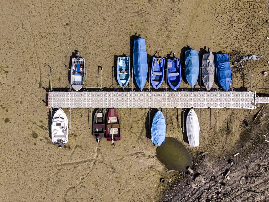 Stranded boats are pictured on the dried out shore of the Lac des Brenets in Les Brenets, Switzerland, this Tuesday, September 18, 2018. The lake is currently seven metres below its usual level and lo ...