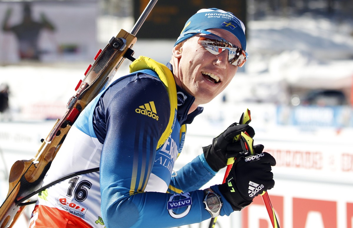 Sweden's Bjoern Ferry celebrates his victory in the men's 15km mass start at the biathlon World Cup competition in Pokljuka, Slovenia, Sunday, March 9, 2014. (AP Photo/Darko Bandic)
