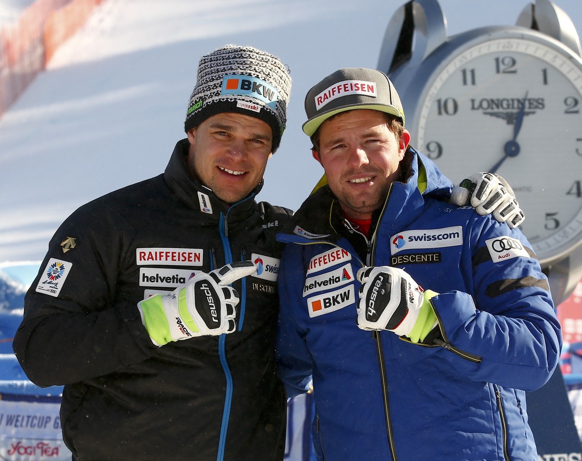 Switzerland's Patrick Kueng, left, and his teammate Beat Feuz pose in front of the Kandahar slope after an alpine ski, men's World Cup downhill training, in Garmisch Partenkirchen, Germany,  ...