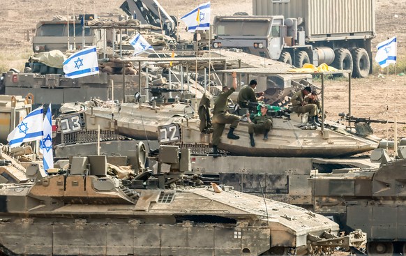 epa10935396 Israeli soldiers gathered for the ground maneuver scenario at a secret location near the Gaza border, in Israel, October 24, 2023. More than 5,000 Palestinians and more than 1,400 ...