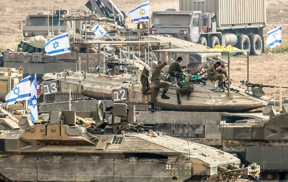 epa10935396 Israeli soldiers gathered for the scenario of ground maneuvers at an undisclosed location near the border with Gaza, in Israel, 24 October 2023. More than 5,000 Palestinians and over 1,400 ...