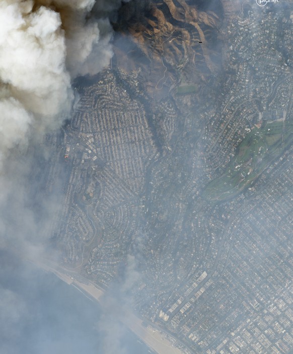 This satellite image taken by Planet Labs PBC, shows the smoke of Palisades Fire is seen over Los Angeles, Calif. on Jan. 8, 2025. (Planet Labs PBC via AP)