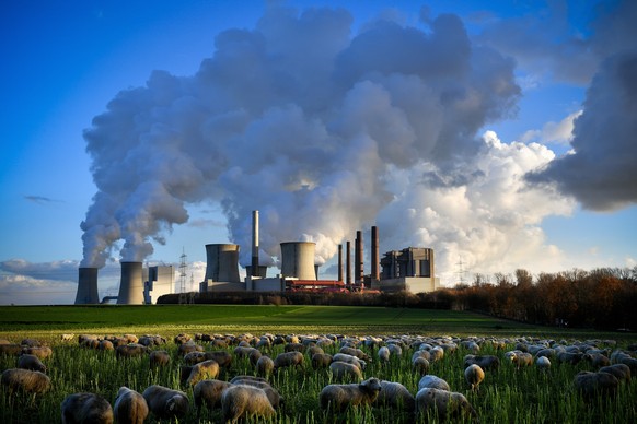 epa08132474 (FILE) - Steam rises from the brown coal-fired power plant Neurath (front-C) and Niederaussem (rear-L) operated by RWE in Bergheim, 04 December 2018 (reissued 16 January 2020). According t ...