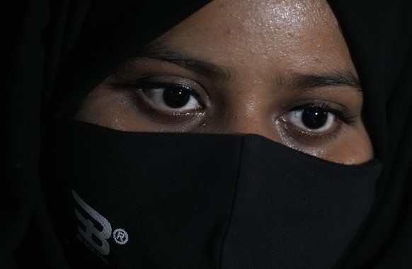 Ayesha Imtiaz, an Indian Muslim student barred from school for wearing hijab sits for an interview with the Associated Press at a cafe in Udupi, Karnataka state, India, Thursday, Feb. 24, 2022. Muslim ...