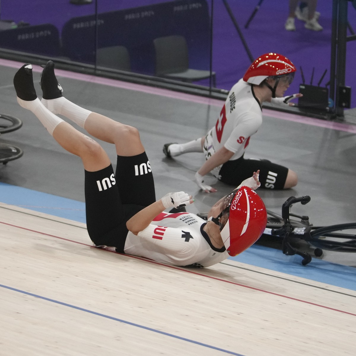 Switzerland's Aline Seitz and Michelle Andres crash during the women's madison event at the Summer Olympics, Friday, Aug. 9, 2024, in Paris, France. (AP Photo/Thibault Camus)