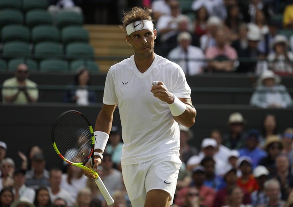 Spain&#039;s Rafael Nadal reacts after winning a point against Japan&#039;s Sugita Yuichi in a singles match during day two of the Wimbledon Tennis Championships in London, Tuesday, July 2, 2019. (AP  ...