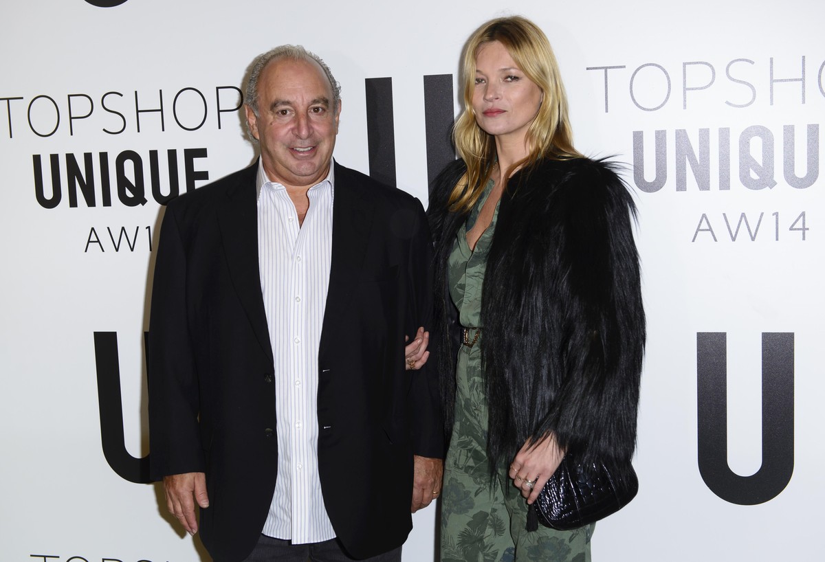 British businessman Sir Philip Green and British model Kate Moss attend the Topshop Unique collection during London Fashion Week Autumn/Winter 2014, at the Tate Modern in central London, Sunday, Feb.  ...