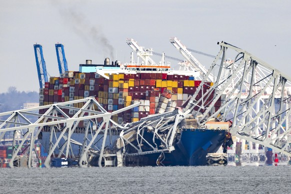 epa11244639 The Francis Scott Key Bridge rests partially collapsed after a cargo ship ran into it in Baltimore, Maryland, USA, 26 March 2024. The Maryland Department of Transportation (MDOT) confirmed ...