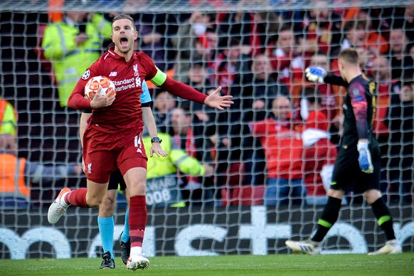 epa07554435 Liverpool&#039;s Jordan Henderson (L) celebrates his team&#039;s 1-0 lead during the UEFA Champions League semi final second leg soccer match between Liverpool FC and FC Barcelona at Anfie ...