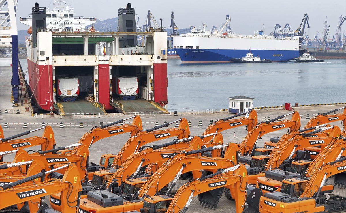 FILE - Engineering vehicles for export wait for transportation from a port in Yantai in eastern China's Shandong province, Tuesday, Nov. 19, 2024. (Chinatopix Via AP, File)