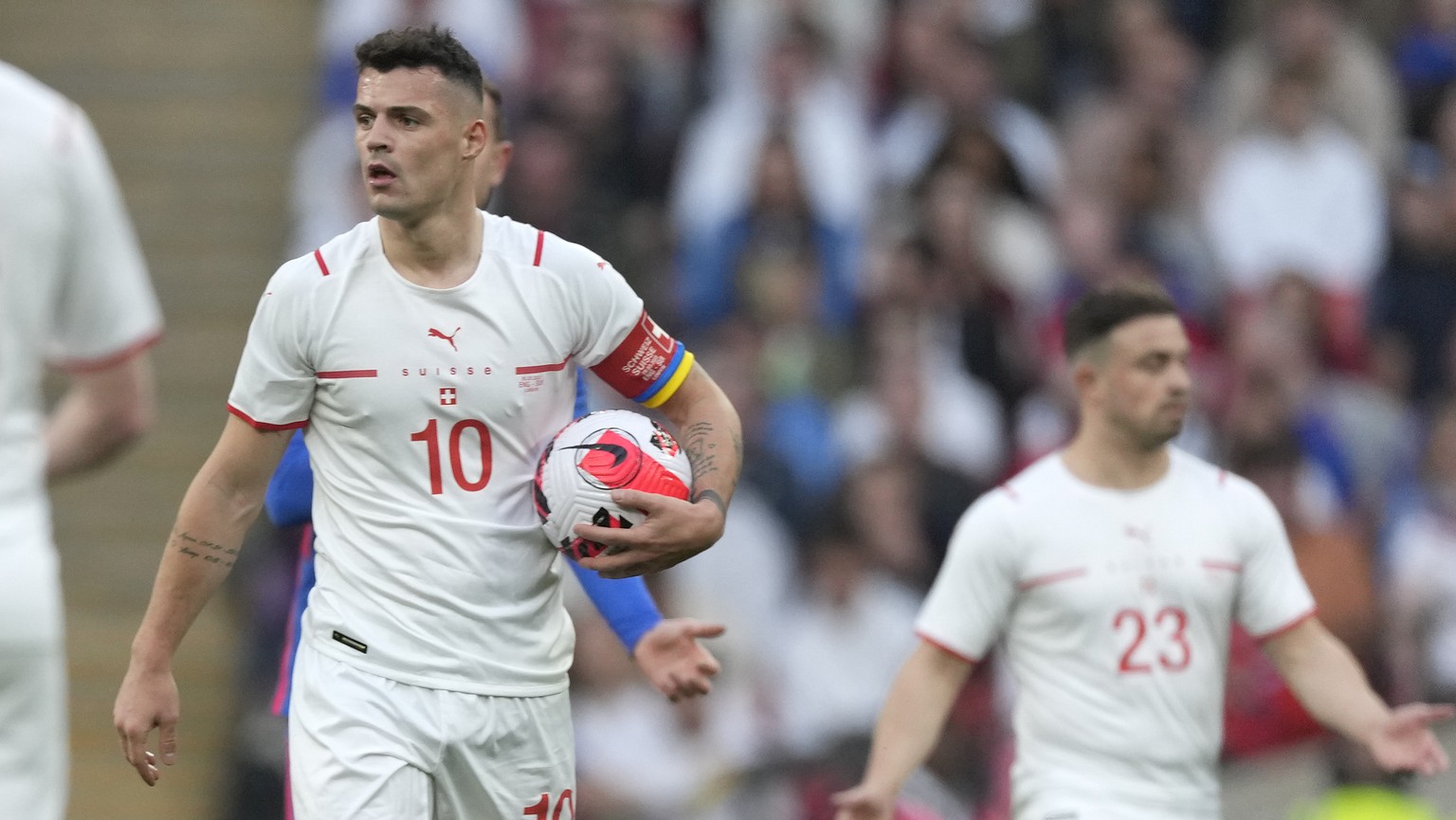 Switzerland&#039;s Granit Xhaka holds the ball during a break in play during an international soccer match between England and Switzerland at Wembley Stadium in London, Saturday, March 26, 2022. (AP P ...