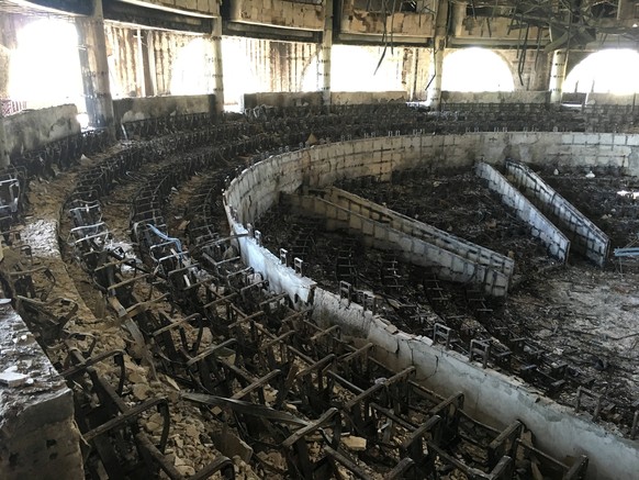 FILE PHOTO: The charred interior of the parliament is seen after it was burned in post-election protests in Libreville, Gabon, September 20, 2016. REUTERS/Edward McAllister/File Photo