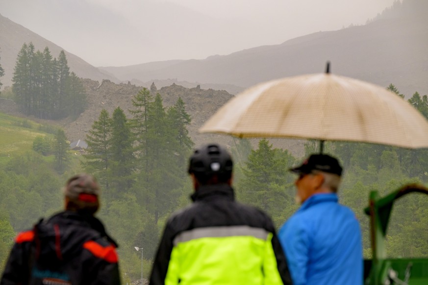 A large avalanche with a mixture of ice, rock, snow and water reach the valley floor is pictured in Wiler after the Birch glacier collapsing above Blatten, Switzerland, Wednesday, May 28, 2025. (KEYST ...