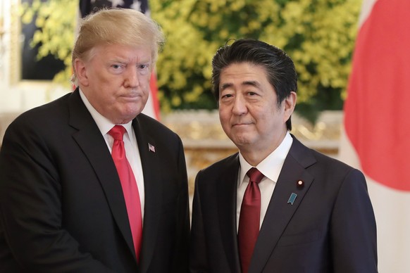 FILE - U.S. President Donald Trump, left, and Japanese Prime Minister Shinzo Abe pose for a photo prior to their meeting at Akasaka Palace, Japanese state guest house, in Tokyo on May 27, 2019. Former ...