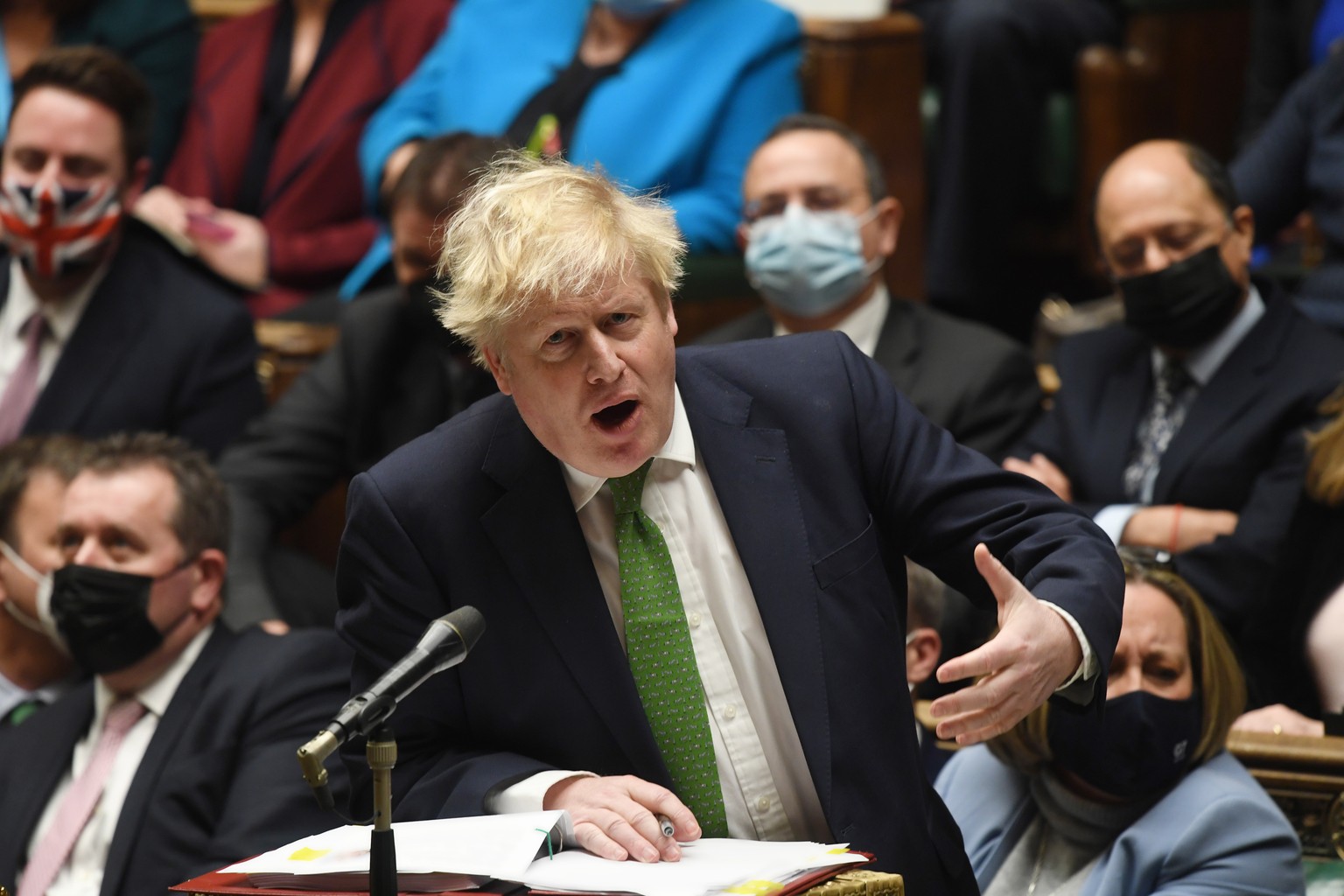 epa09695285 A handout photograph released by the UK Parliament shows British Prime Minister Boris Johnson speaking during Prime Minister&#039;s Questions (PMQs) at the House of Common in London, Brita ...
