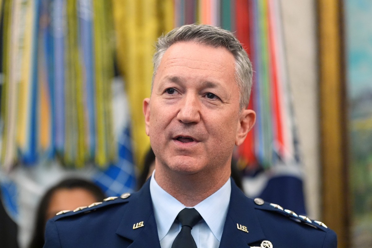 Gen. Dan Caine, chairman of the Joint Chiefs of Staff, speaks during a meeting about military families with President Donald Trump, in the Oval Office of the White House, Monday, Aug. 3, 2026, in Wash ...