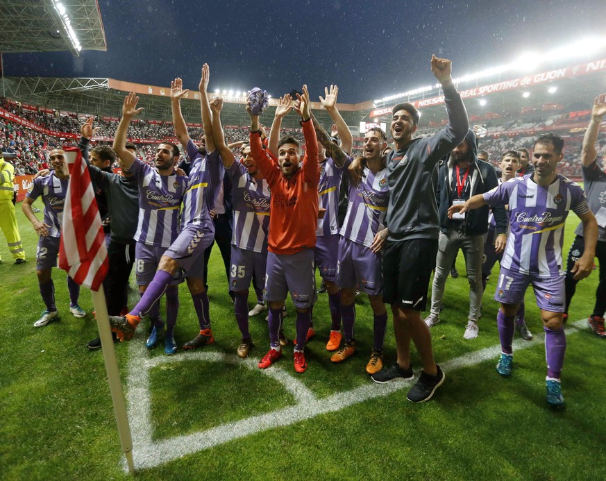 epa06799731 Real Valladolid players celebrate their promotion to LaLiga First Division League after defeating Sporting Gijon in their Second Division League soccer match at the Molinon stadium in Gijo ...