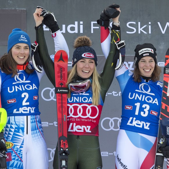 epa08093754 (L-R) Second placed Petra Vlhova of Slovakia,, winner Mikaela Shiffrin of the USA and third placed Michelle Gisin of Switzerland celebrate on the podium for the Women&#039;s Slalom race at ...