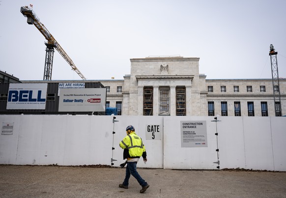 epa12579066 A worker at the site as construction continues at the Federal Reserve headquarters' two historic buildings in Washington, DC, USA, 08 December 2025, that have not been fully renovated ...