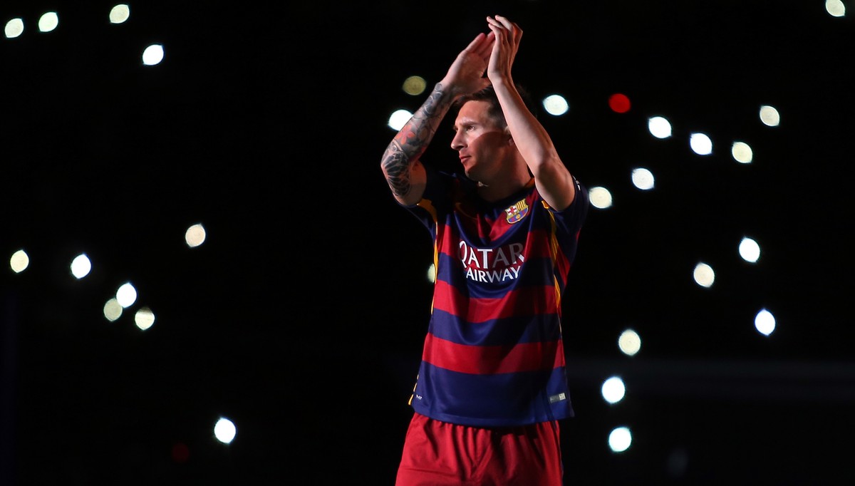 FILE - In this Aug. 5, 2015 file photo, Barcelona's Lionel Messi applauds as he enters the pitch during the presentation of the team for the new season at the Camp Nou stadium in Barcelona, Spain ...