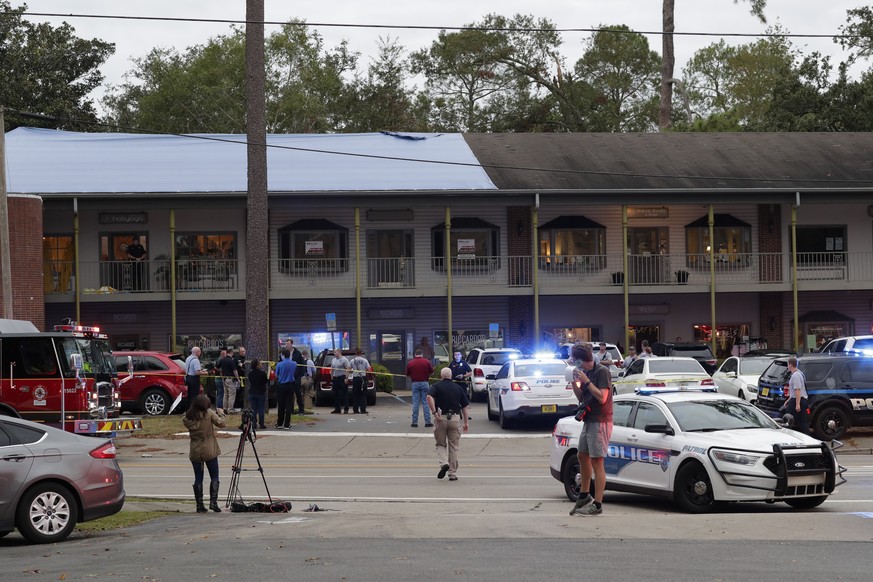 Police investigators work the scene of a shooting, Friday, Nov. 2, 2018, in Tallahassee, Fla. A shooter killed one person and critically wounded four others at a yoga studio in Florida&#039;s capital  ...